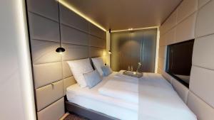 Postel nebo postele na pokoji v ubytování White Pearl Apartment 1.08