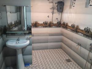 a bathroom with a sink and a mirror at Mi Casa Bentota in Bentota