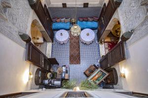 an overhead view of a room with clocks on the wall at Dar Settash in Fès