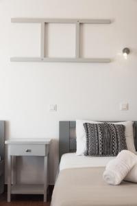 A bed or beds in a room at Three Seasons