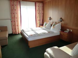 Krevet ili kreveti u jedinici u okviru objekta Alpenhotel Tauernstüberl