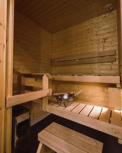 an inside of a sauna with a bowl in it at Yllas Chalet VIII 8105 in Ylläs