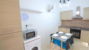 Η κουζίνα ή μικρή κουζίνα στο Apartment close to Fort Saint Angelo +16 φωτογραφίες