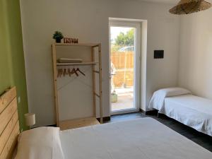 Postel nebo postele na pokoji v ubytování Cilento rooms + 9 fotografií