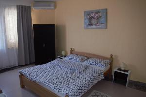 Postel nebo postele na pokoji v ubytování Apartments Japuncic