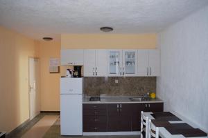 Kuchyň nebo kuchyňský kout v ubytování Apartments Japuncic