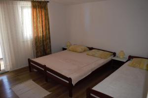 Postel nebo postele na pokoji v ubytování Apartments Japuncic
