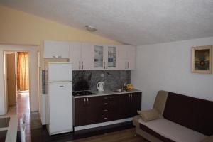 Kuchyň nebo kuchyňský kout v ubytování Apartments Japuncic