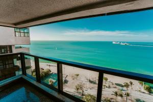 a view of the ocean from a condo balcony at Iracema Residence Hotel Flat in Fortaleza
