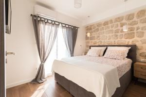 Postel nebo postele na pokoji v ubytování Villa O'Zrna