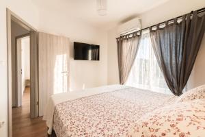 Postel nebo postele na pokoji v ubytování Villa O'Zrna