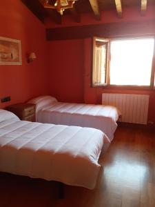 Postel nebo postele na pokoji v ubytování Casa Rural Izarrak