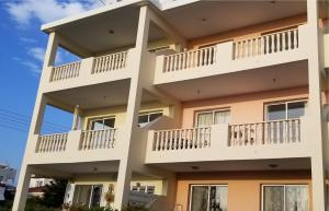 a building with balconies on the side of it at Penthouse Apartment Universal in Paphos City