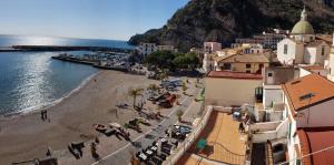 a view of a beach with a group of people at Cetara on the sea in Cetara