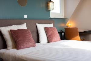 Een bed of bedden in een kamer bij Strandhotel Scheveningen