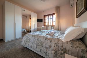 En eller flere senge i et værelse på Casa Vacanze Villa Chiara