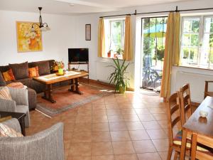 a living room with a couch and a table at Landhaus im Grünen in Nehringen