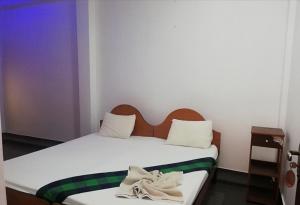 Łóżko lub łóżka w pokoju w obiekcie Sunshine Hotel