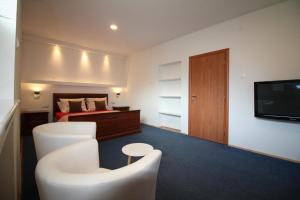 En eller flere senge i et værelse på Apartment City Centre free parking 1&2 floor