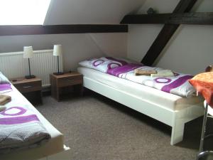 מיטה או מיטות בחדר ב-Pension an der Havel