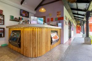 a store with a tv in the middle of a building at Socialtel Antigua in Antigua Guatemala