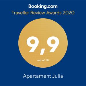 een gele cirkel met de prijzen voor tekstbeoordelingen en appartement Julia bij Apartament Julia in Karwia