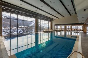 a swimming pool with a view of the mountains at Jermuk Hotel and SPA in Jermuk
