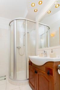 a bathroom with a shower and a sink at Apartament Old City Center Gdańsk by Renters in Gdańsk