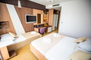 Postel nebo postele na pokoji v ubytování Hotel Herceg