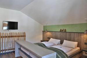 Llit o llits en una habitació de Das Schönanger Ferienwohnungen