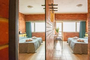 Postel nebo postele na pokoji v ubytování Hotel Marina