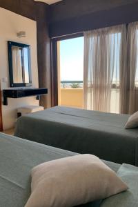 Ένα ή περισσότερα κρεβάτια σε δωμάτιο στο Apartamentos Guadiana
