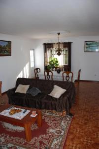 a living room with a couch and a table at AFIFE "Porta da Alegria" in Viana do Castelo