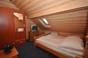 Кровать или кровати в номере Willa Hostel Kasprowy