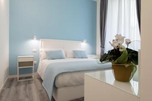 A bed or beds in a room at Napoliving