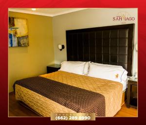 a hotel room with a bed with a large headboard at Hotel Santiago Plaza in Hermosillo +1 photo