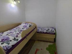 Postel nebo postele na pokoji v ubytování Andrey Apartment