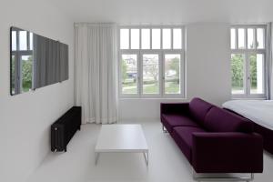 TV a/nebo společenská místnost v ubytování Zenden Hotel Maastricht