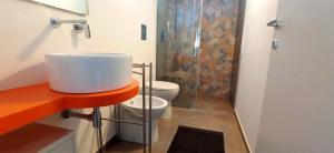 a bathroom with a sink and a shower and a toilet at Villa Cappèddu in Balestrate +37 photos