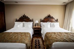 Cama ou camas em um quarto em Nino Hotel Boutique