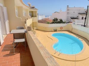 Вид на бассейн в Fournier Apartment - Praia da Luz или окрестностях