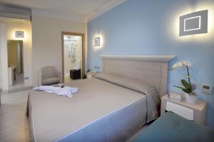Postel nebo postele na pokoji v ubytování Hotel Belvir