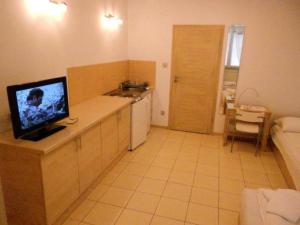 a kitchen with a tv on top of a counter at Standard Delegacyjny Bed & Breakfast in Dąbrowa Górnicza