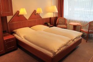 Postel nebo postele na pokoji v ubytování Hotel Morjan