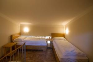 a bedroom with two beds and a staircase at Apartments Erica Luxury in Novigrad Istria