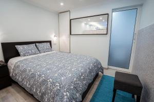 Ein Bett oder Betten in einem Zimmer der Unterkunft Central Praia Beach