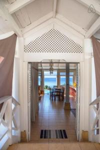 a living room with a view of the ocean at Villa Ora in Teavaro