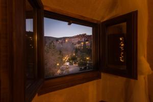 a window with a view of a city at Posada del Rodeno in Albarracín
