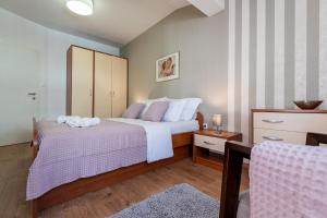Posteľ alebo postele v izbe v ubytovaní Iva Apartment + 30 fotografií