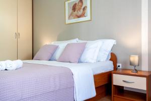 Posteľ alebo postele v izbe v ubytovaní Iva Apartment